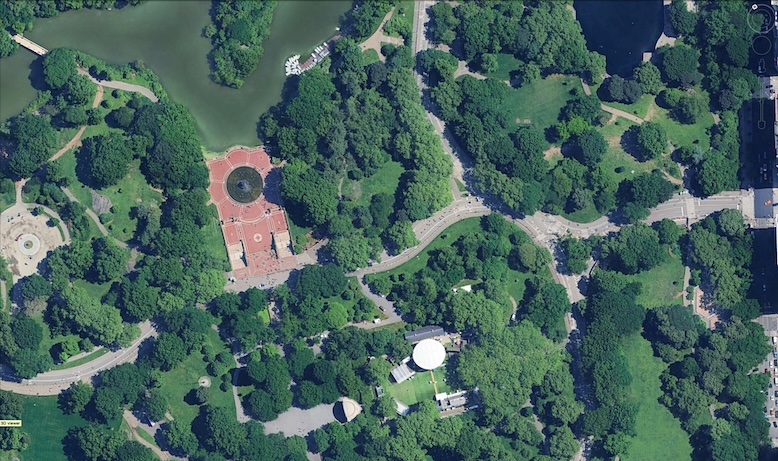 Aerial photograph showing an urban park with trees, lawns, walkways, and water features