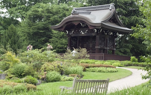 View of a lawn and oriental pavilion at Kew Gardens